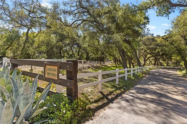 an outdoor space with wooden fence