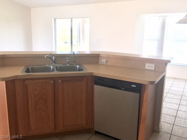 3608 13th Street Southwest Lehigh Acres, FL 33976 - Photo 1 of 11 a kitchen with a sink and a window