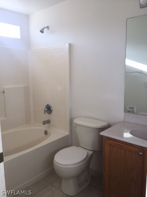 3608 13th Street Southwest Lehigh Acres, FL 33976 - Photo 4 of 11 a white toilet sitting next to a bath tub