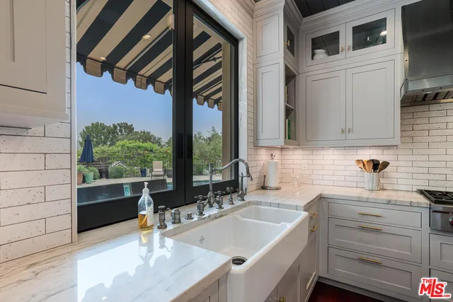a kitchen with a sink and cabinets
