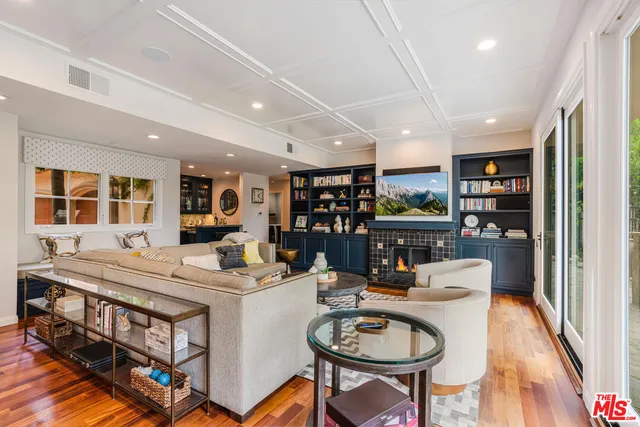 a dining room with stainless steel appliances kitchen island a table and chairs