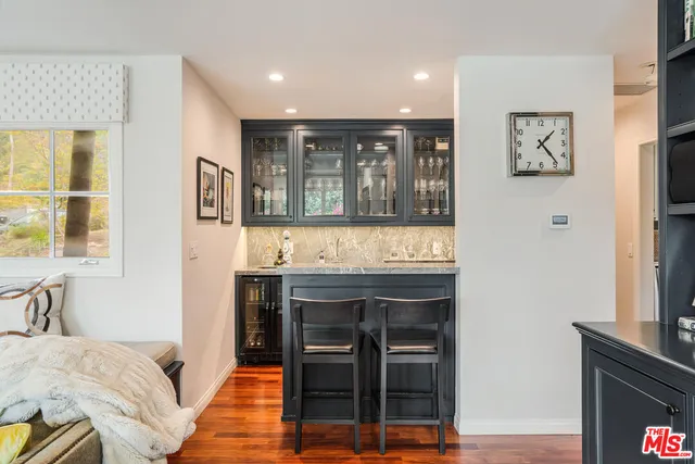 a living room with a fireplace furniture and a flat screen tv