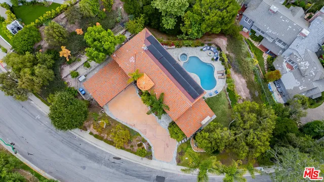 an aerial view of house with yard