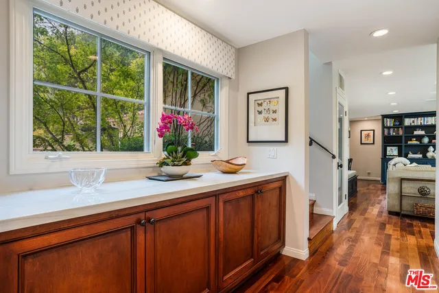 a kitchen with sink cabinets and wooden floor