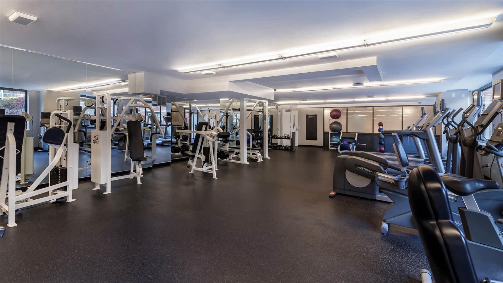 505 West 54th Street, Unit 915 Manhattan, NY 10019 - Photo 5 of 10 a view of a room with gym equipment