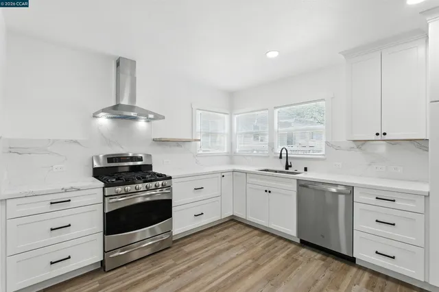 a kitchen with a sink cabinets and window