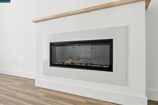 a kitchen with stainless steel appliances a refrigerator and a stove top oven