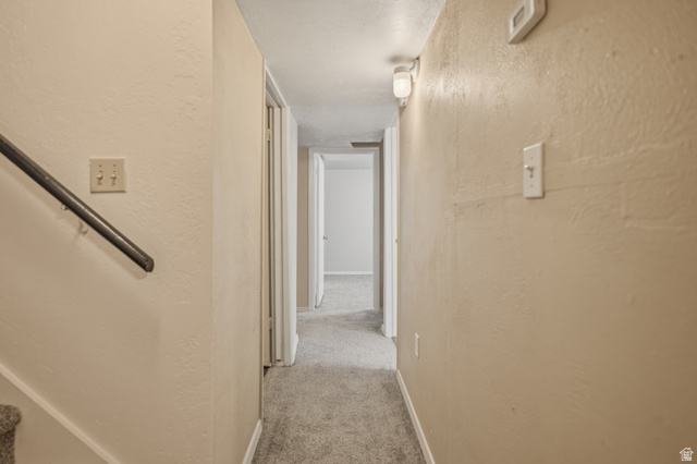 337 North Main Street Central Valley, UT 84754 - Photo 32 of 40 Hall with a textured wall and light carpet