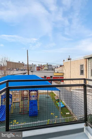 a view of a balcony and city view