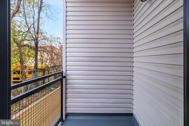 a view of a balcony with wooden floor
