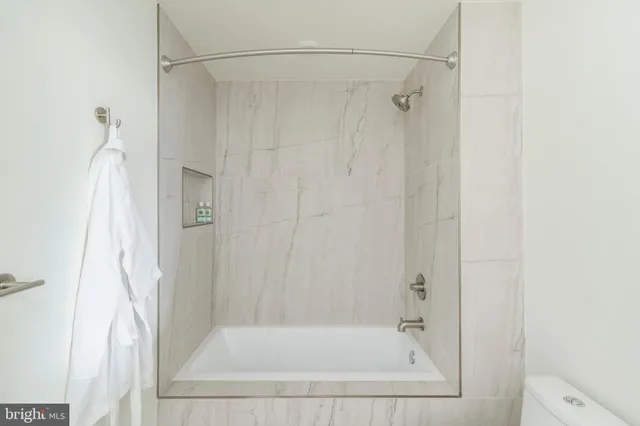 a bathroom with a bath tub