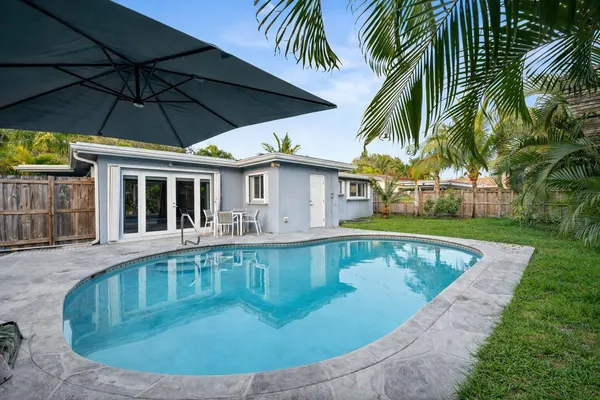 a view of a house with swimming pool