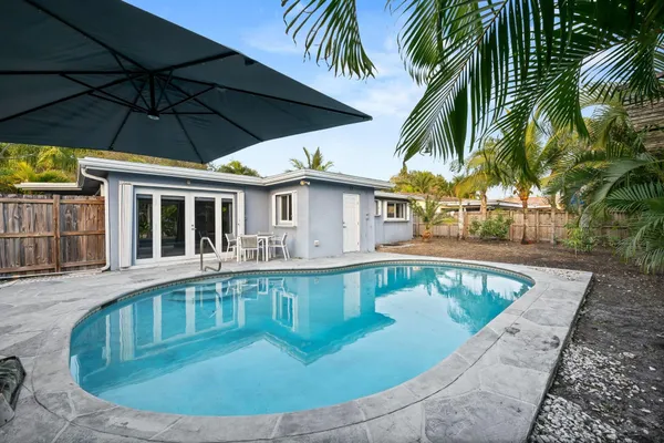 a view of a swimming pool with a patio