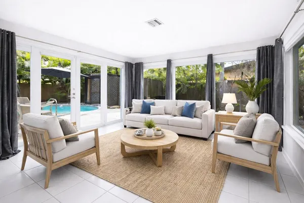 a living room with furniture and a large window