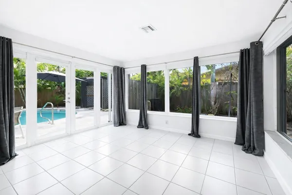 a view of an empty room with windows