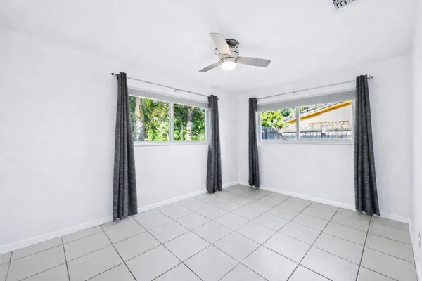 a view of an empty room and window