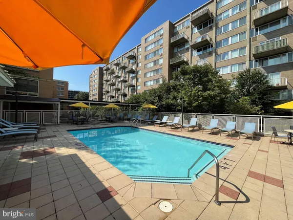 a view of a swimming pool with a lounge chairs