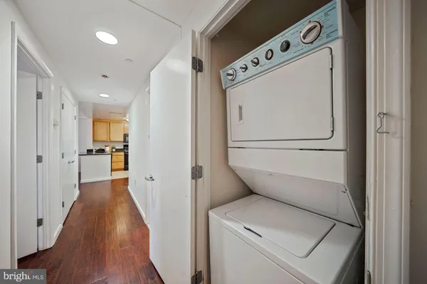a view of hallway with wooden floor