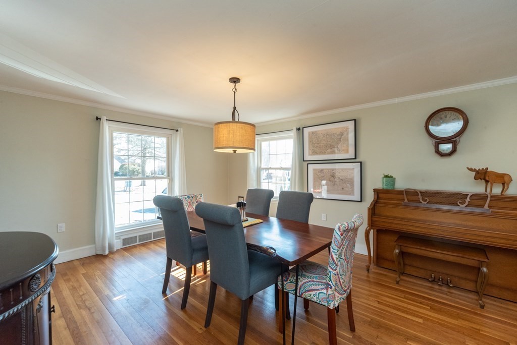 112 Elmwood Street Auburn, MA 01501 - Photo 14 of 40 a view of a dining room with furniture window and wooden floor