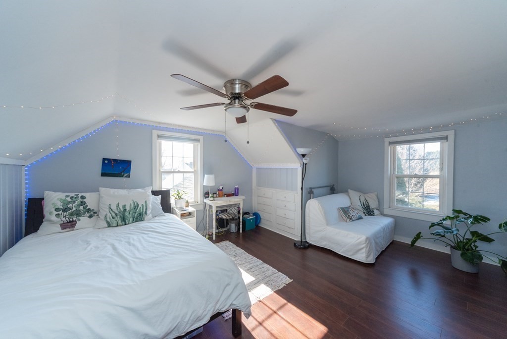 112 Elmwood Street Auburn, MA 01501 - Photo 27 of 40 a bedroom with a bed furniture potted plant and a window