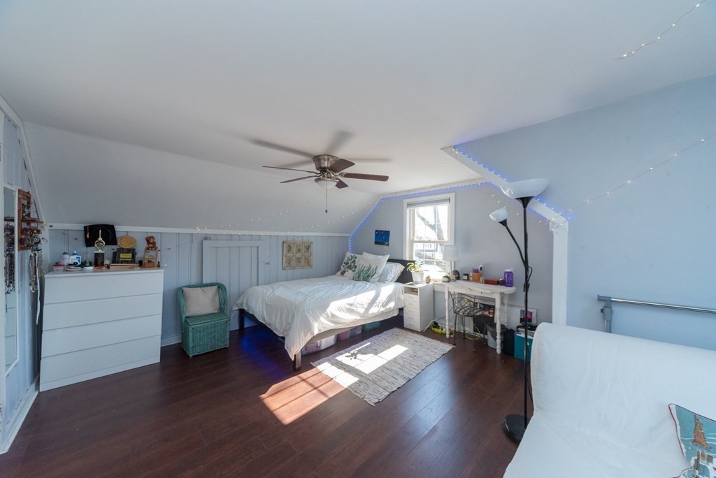 112 Elmwood Street Auburn, MA 01501 - Photo 28 of 40 a living room with furniture and a wooden floor