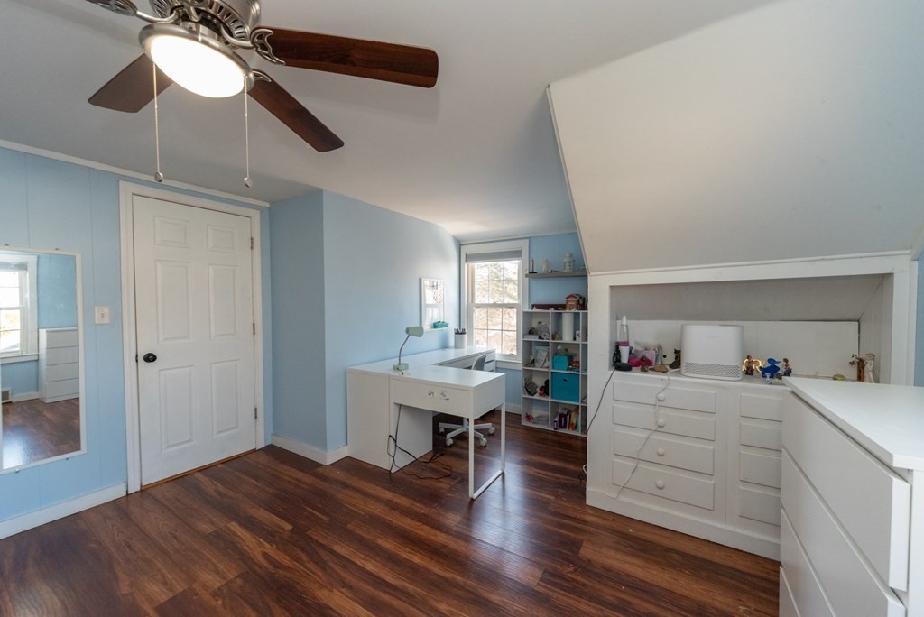 112 Elmwood Street Auburn, MA 01501 - Photo 31 of 40 a room with lots of wooden furniture and a ceiling fan