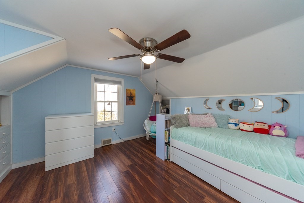 112 Elmwood Street Auburn, MA 01501 - Photo 32 of 40 a bedroom with furniture and a wooden floor
