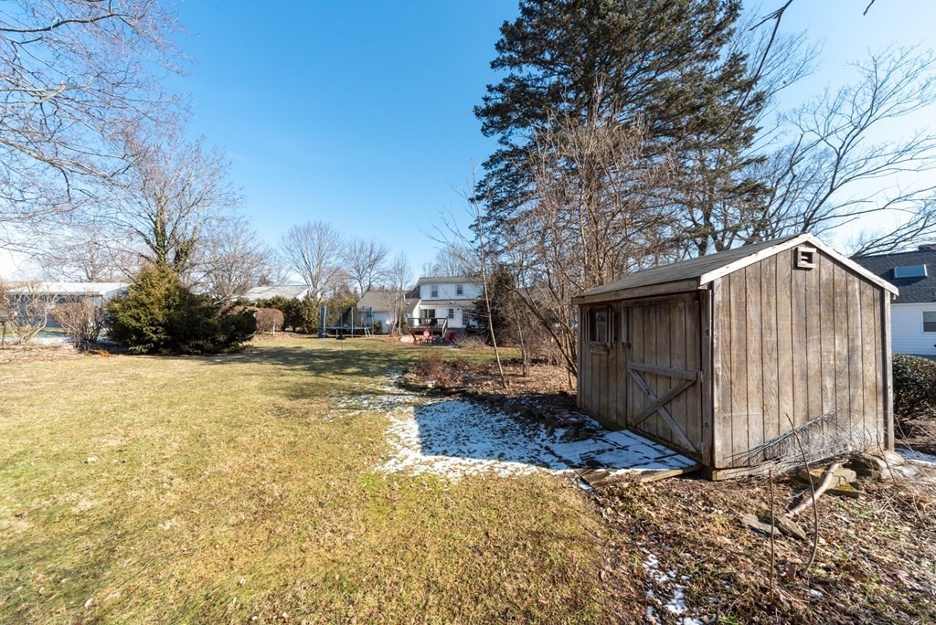 112 Elmwood Street Auburn, MA 01501 - Photo 37 of 40 a view of a house with snow on the road