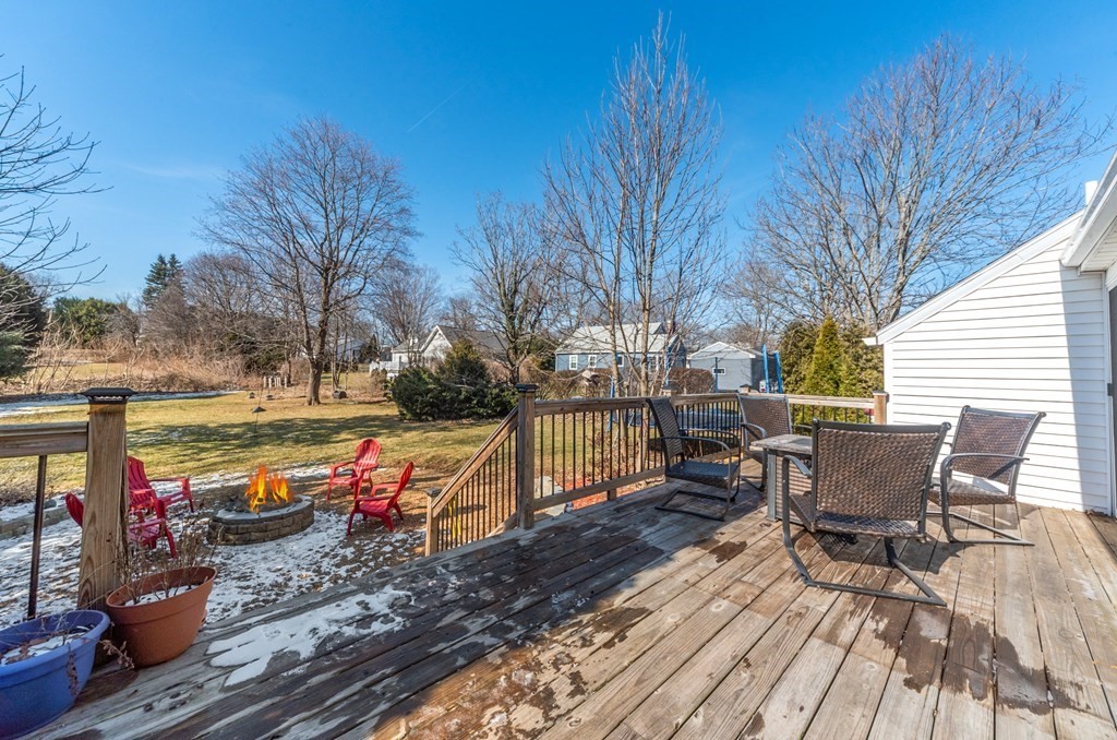 112 Elmwood Street Auburn, MA 01501 - Photo 4 of 40 a view of a patio with table and chairs and wooden floor