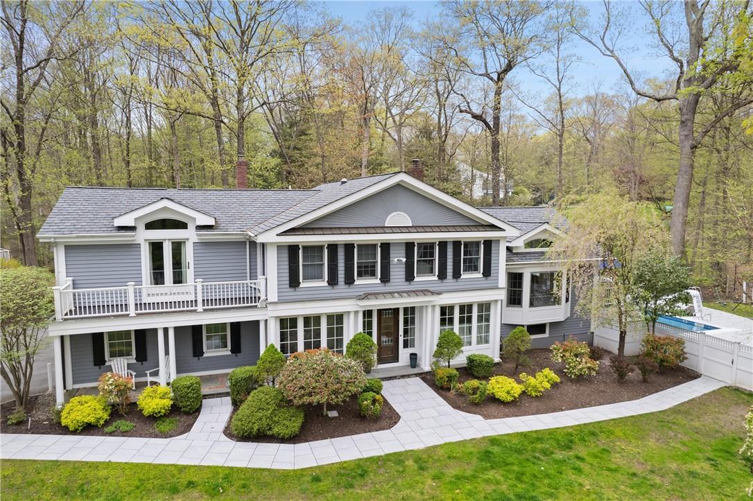 a front view of a house with a yard table and chairs