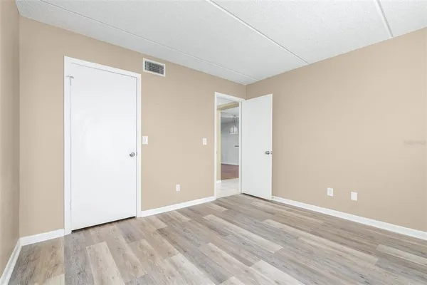 a balcony with chairs and a table