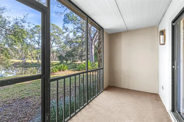 a view of yard with swimming pool and green space