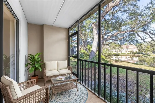 an aerial view of residential house with outdoor space and trees all around