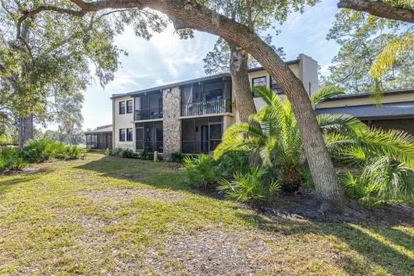 an aerial view of residential house with outdoor space and swimming pool