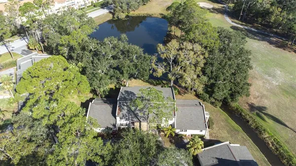 an aerial view of a house with a yard