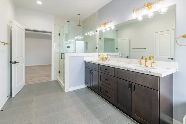 a spacious bathroom with a double vanity sink mirror and double