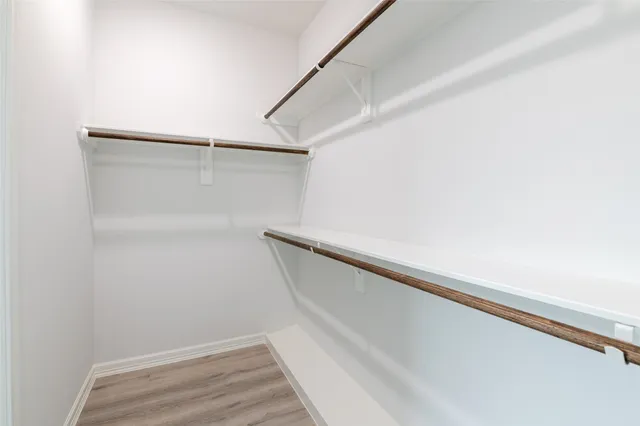 a view of an empty walk in closet