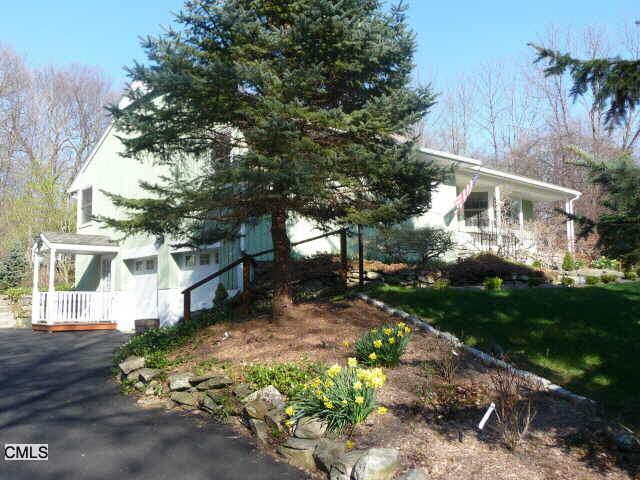 14 Pepperidge Road Newtown, CT 06470 - Photo 1 of 1 a front view of a house with a yard and outdoor seating
