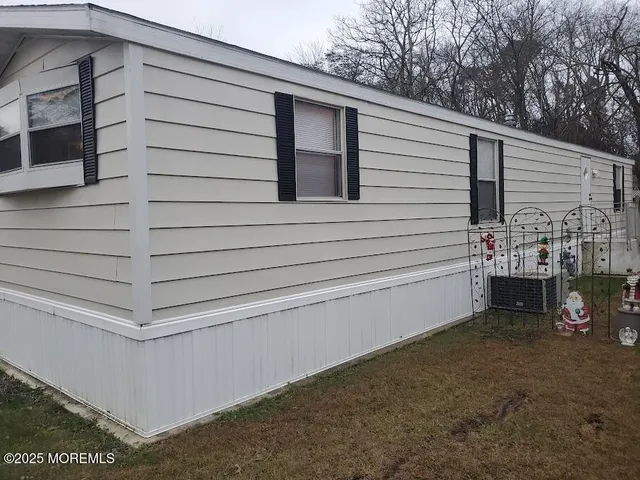 a large kitchen with stainless steel appliances granite countertop a stove a sink and a microwave