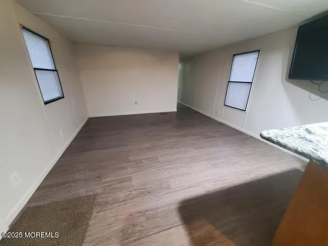 a bedroom with a bed and a bookshelf