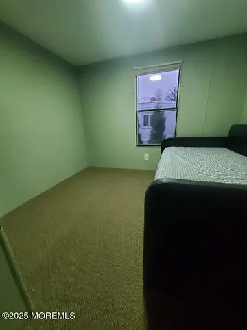 a bathroom with a bathtub and a toilet