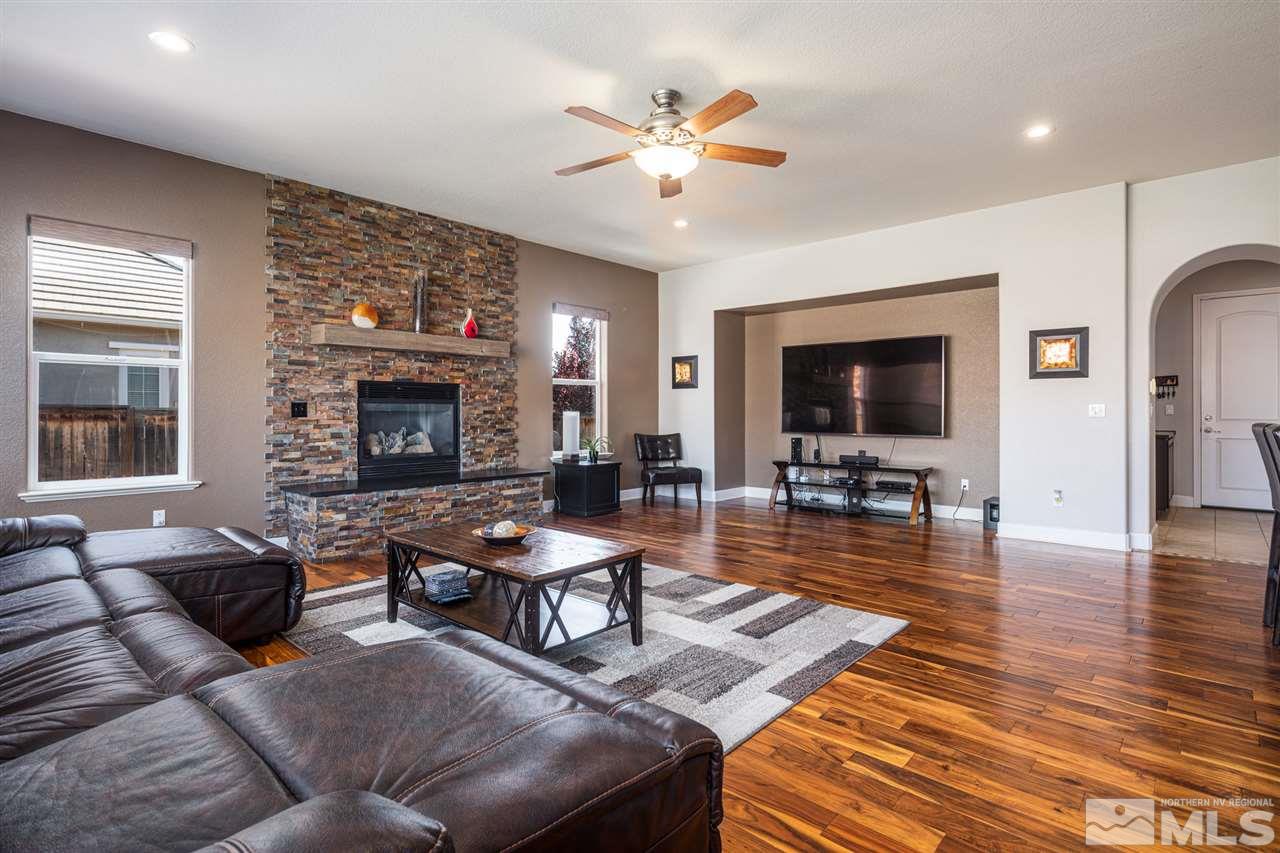 8345 Fairway Ridge Court Reno, NV 89523 - Photo 17 of 40 a living room with furniture and a fireplace