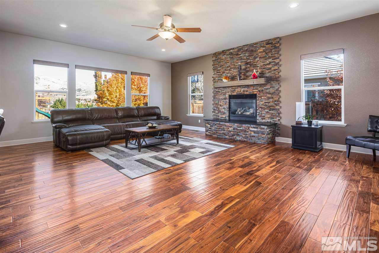 8345 Fairway Ridge Court Reno, NV 89523 - Photo 18 of 40 a living room with furniture and a fireplace