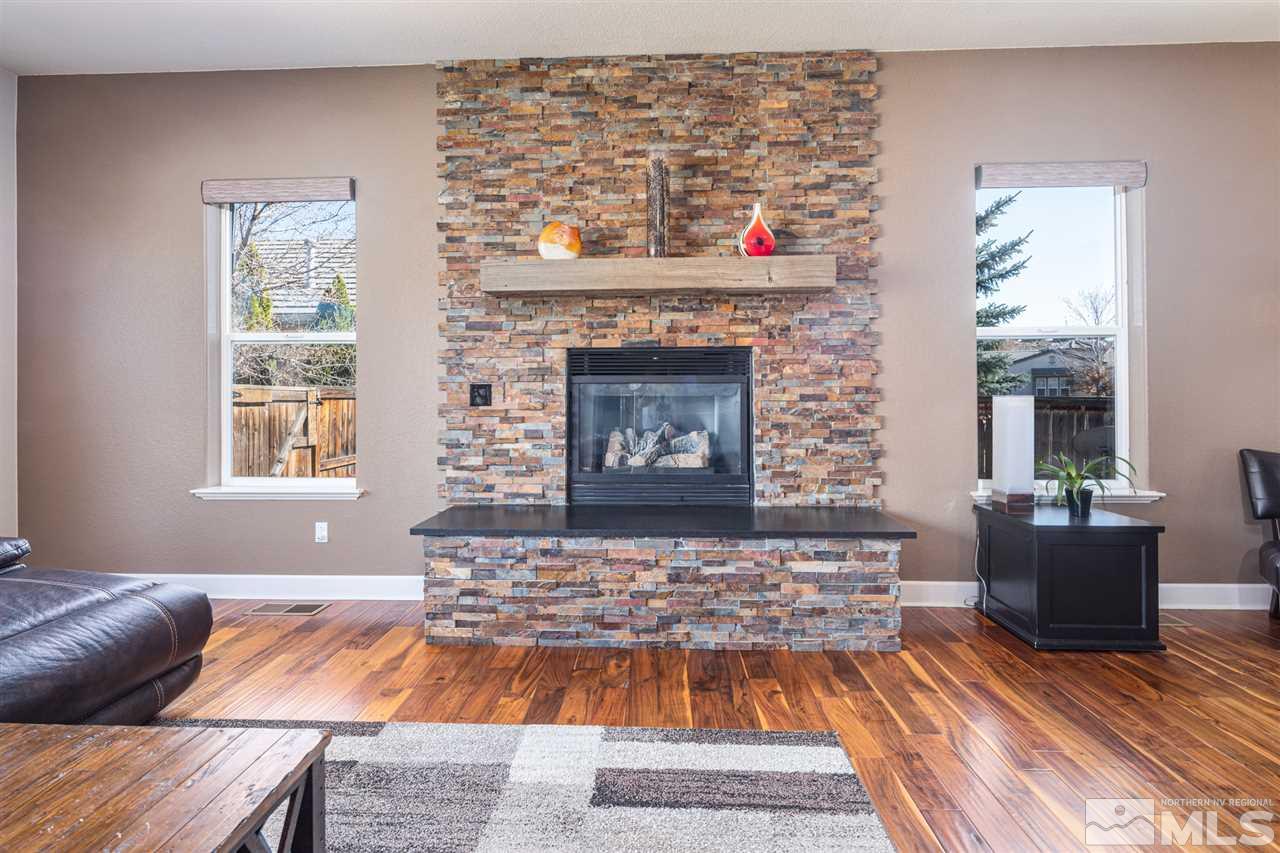 8345 Fairway Ridge Court Reno, NV 89523 - Photo 19 of 40 a living room with furniture and a fireplace