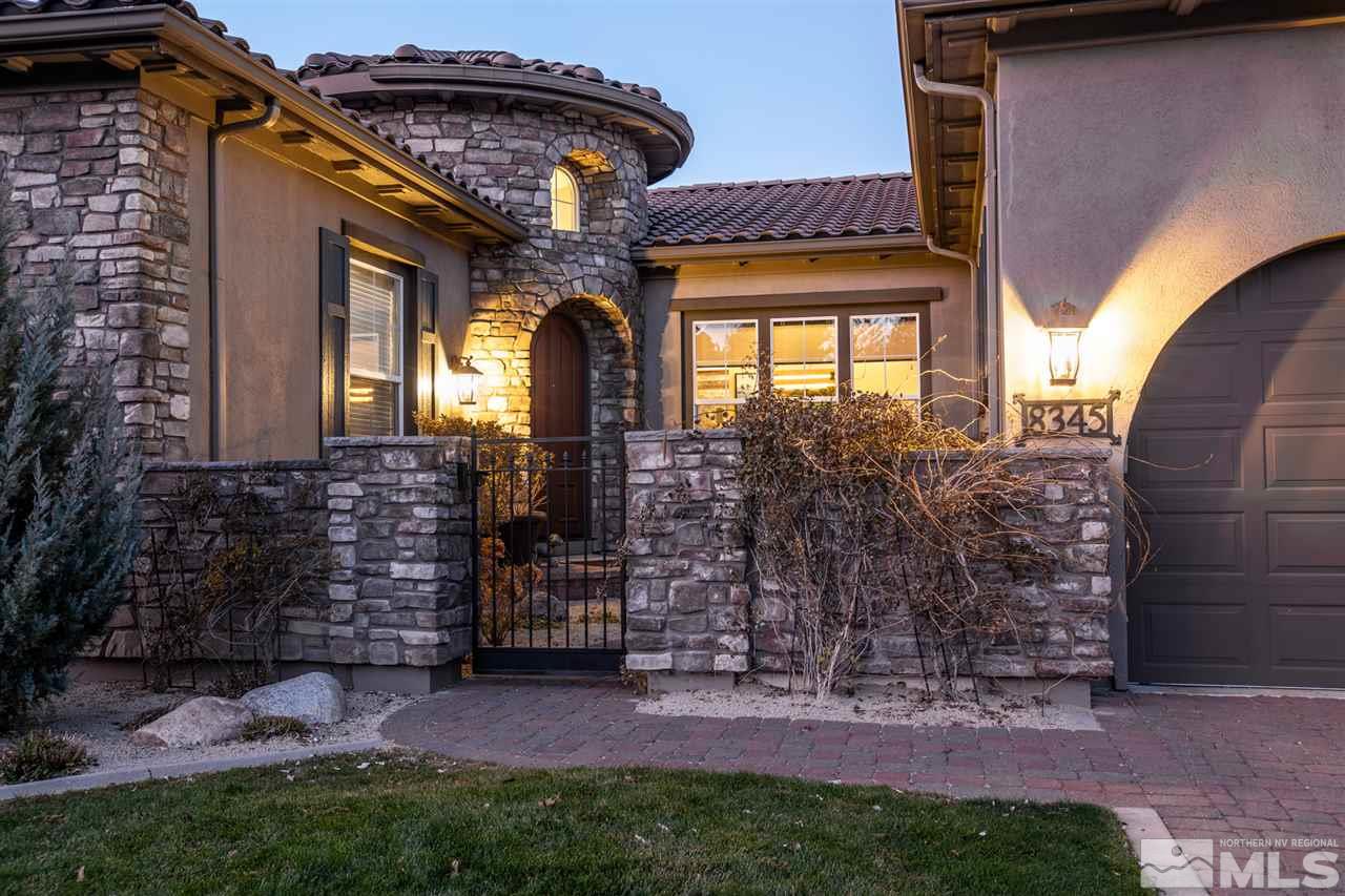 8345 Fairway Ridge Court Reno, NV 89523 - Photo 2 of 40 a front view of a house with a garden