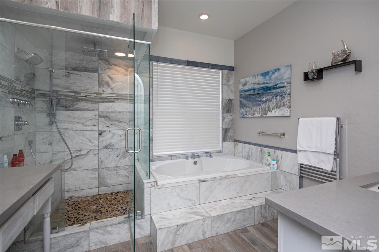 8345 Fairway Ridge Court Reno, NV 89523 - Photo 22 of 40 a bathroom with a bathtub and a shower