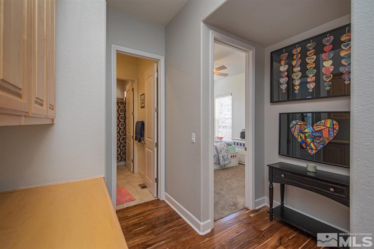8345 Fairway Ridge Court Reno, NV 89523 - Photo 29 of 40 a bedroom with furniture and a gate