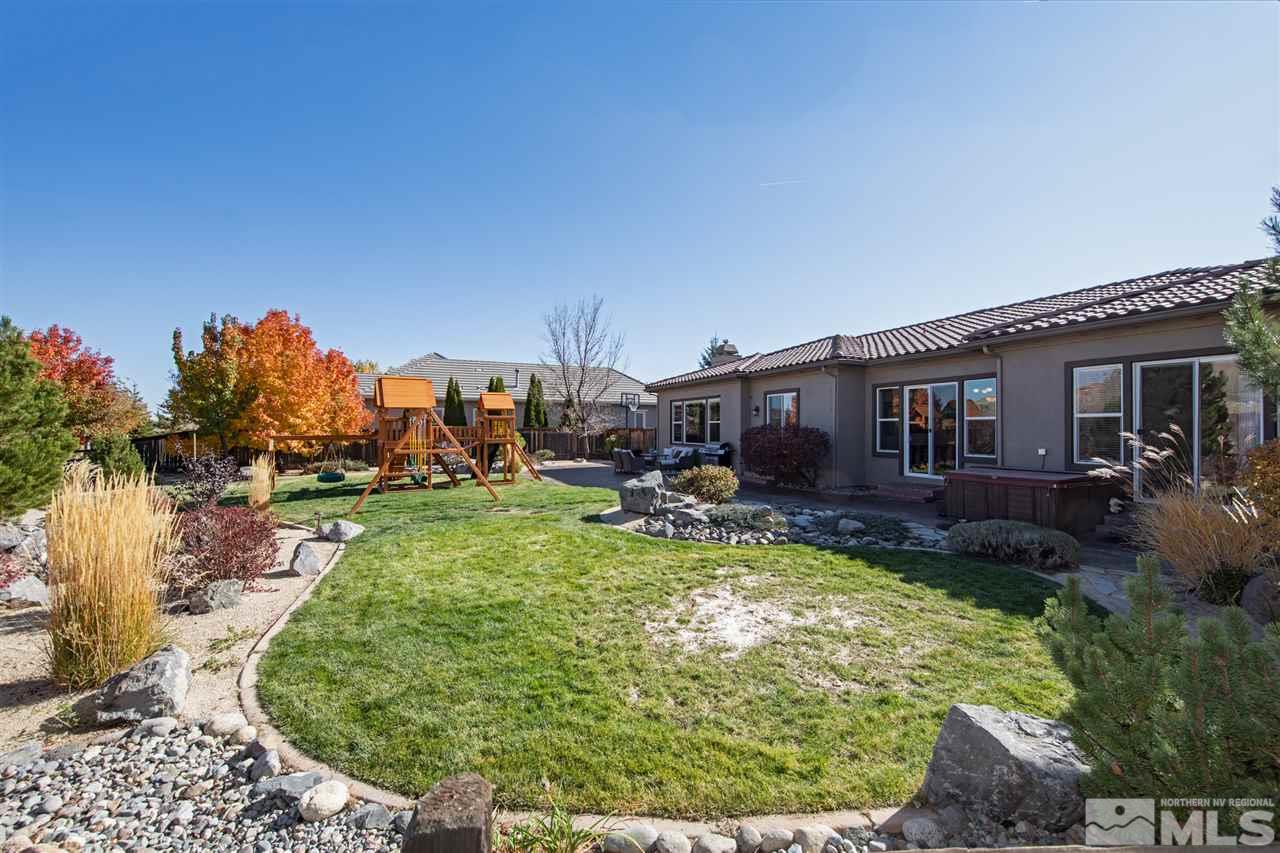 8345 Fairway Ridge Court Reno, NV 89523 - Photo 37 of 40 a view of a house with backyard porch and sitting area