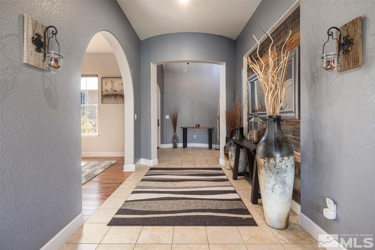 8345 Fairway Ridge Court Reno, NV 89523 - Photo 7 of 40 a view of a hallway with wooden floor and staircase