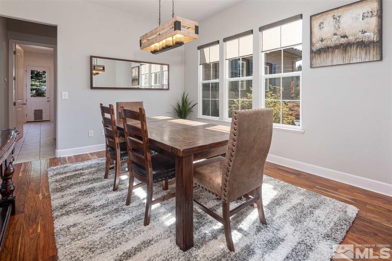 8345 Fairway Ridge Court Reno, NV 89523 - Photo 9 of 40 a view of a dining room with furniture and chandelier